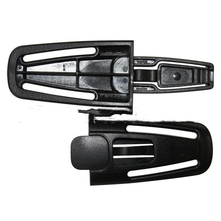 Black nylon chest buckle clip for a child car seat harness with a visible lock button.