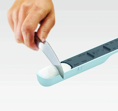Adjustable 12-speed measuring spoon in grey, perfect for precise kitchen measurements