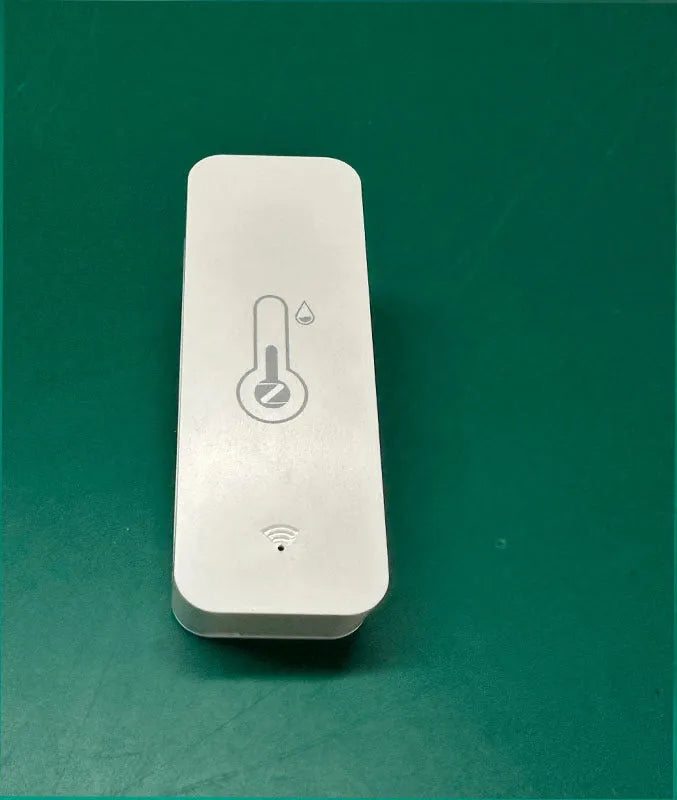 Compact white ABS plastic WiFi and Zigbee temperature and humidity sensor for smart homes.