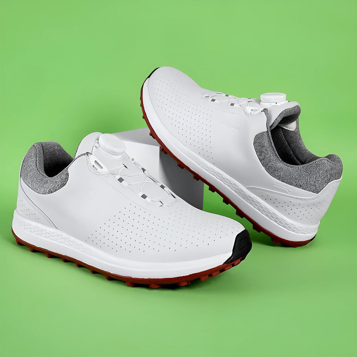 Men's white low-top casual golf shoe with breathable upper and non-slip broken nail sole.