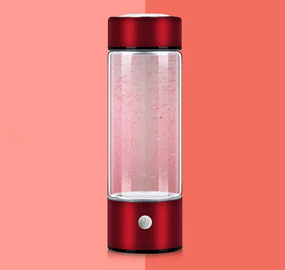 Portable hydrogen water bottle with glass chamber and stainless steel components showing electrolysis bubbles