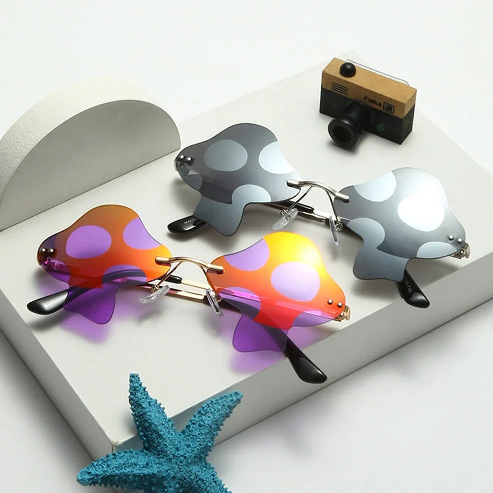 Gold rimless mushroom sunglasses with blue polycarbonate lenses showing 60-port sizing system