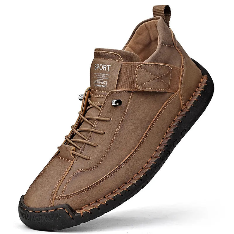 Men's black mid-top Martin boots with elastic band and sewn sole on a plain background.