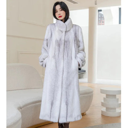 White faux fur women's winter coat with stand-up collar on a hanger