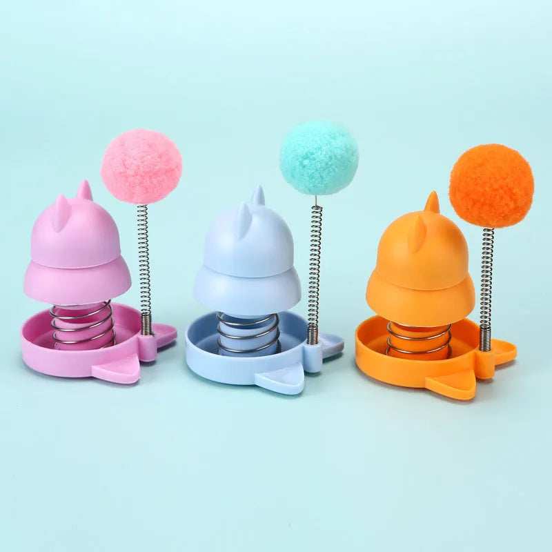 Blue, orange, and pink 55mm lickable mint ball cat toy for dental care and boredom relief.