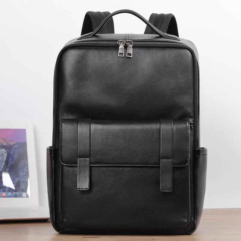 Large capacity men's leather computer backpack with 36-55L storage, genuine first layer cowhide material, business commute style, and physiological curve back plate design in black litchi grain or black fine grain colour options