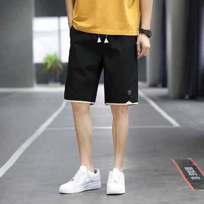 South Korea style loose straight-leg beach shorts in khaki on a plain background