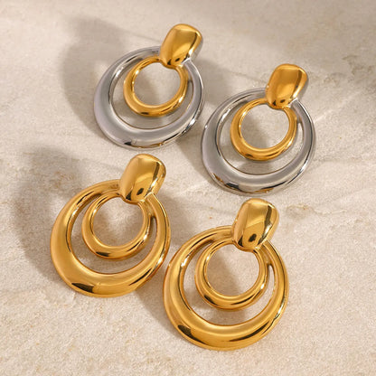 Round double layer hollow stud earrings with 18K gold electroplating on titanium steel, 12mm diameter