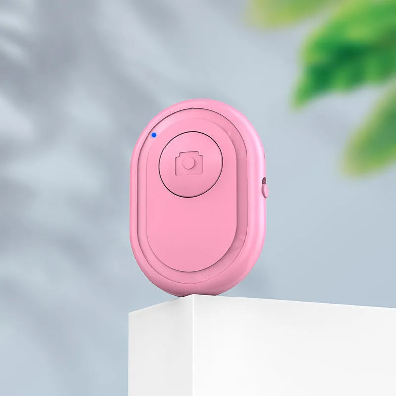 Black wireless Bluetooth remote control for cameras with tripod mount thread