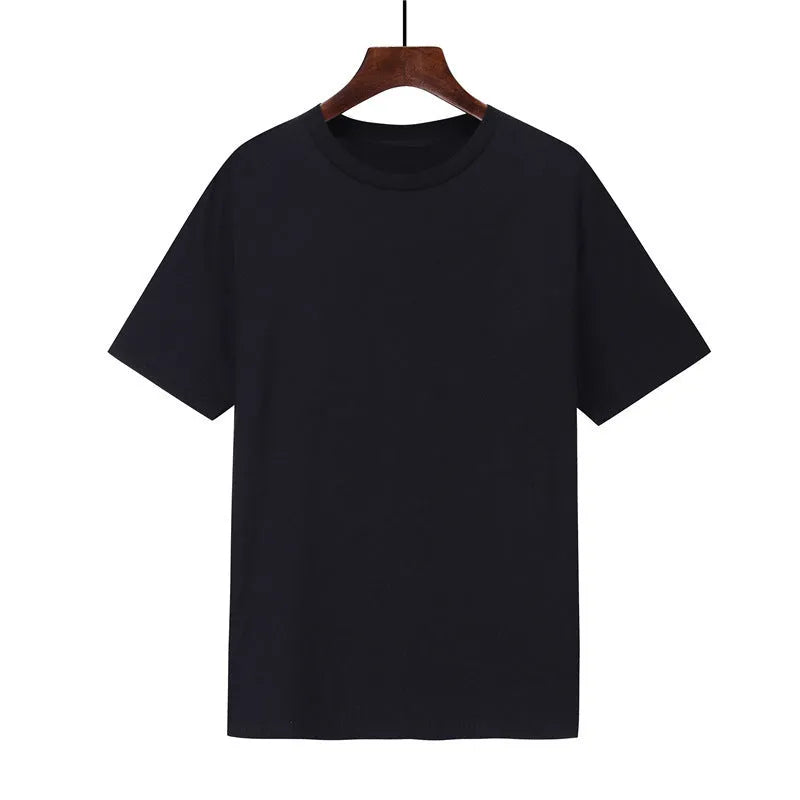 A man's loose-fitting black cotton T-shirt with short sleeves on a hanger.
