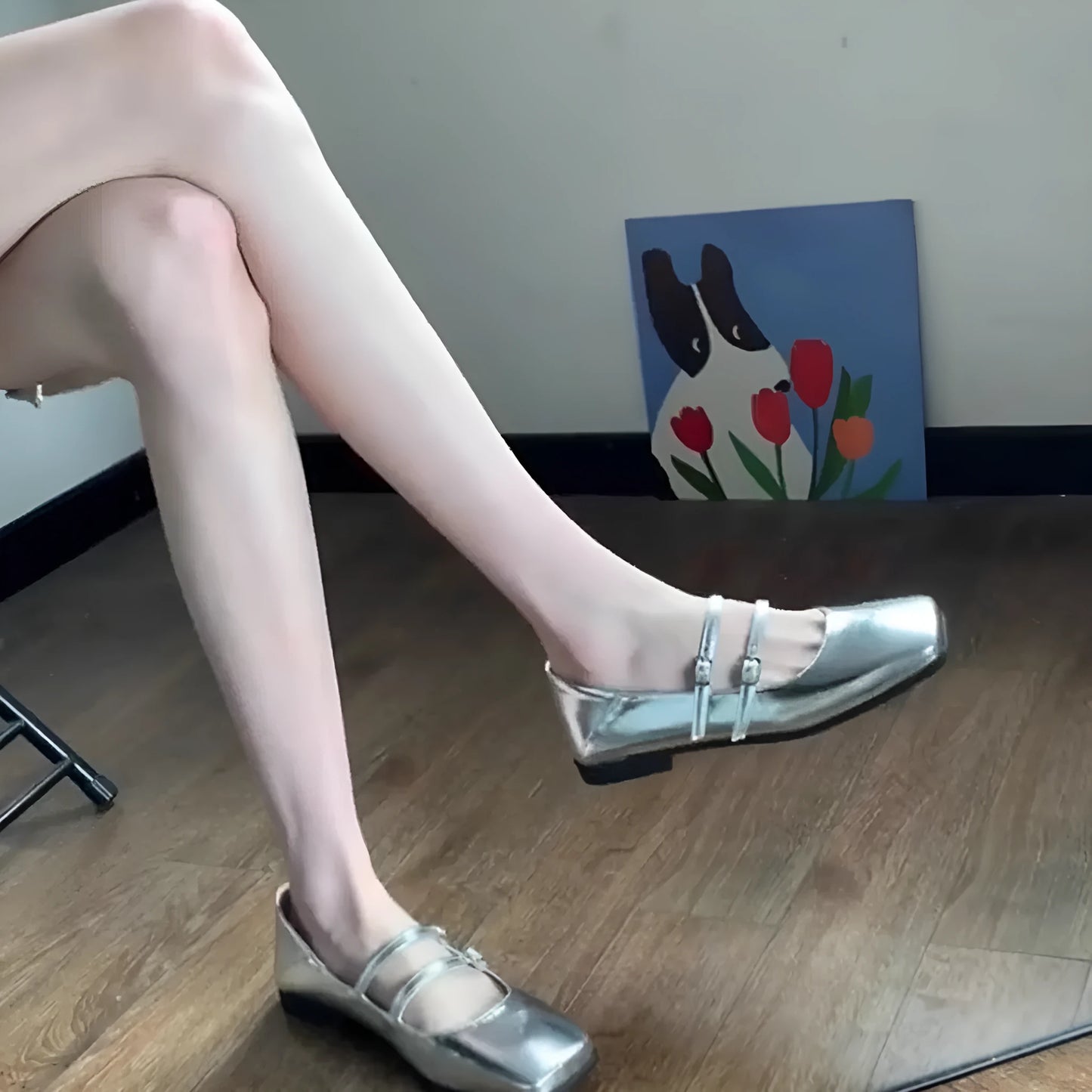 Women's silver genuine sheepskin Mary Jane ballet flats with an adjustable cross-buckle strap on the instep.