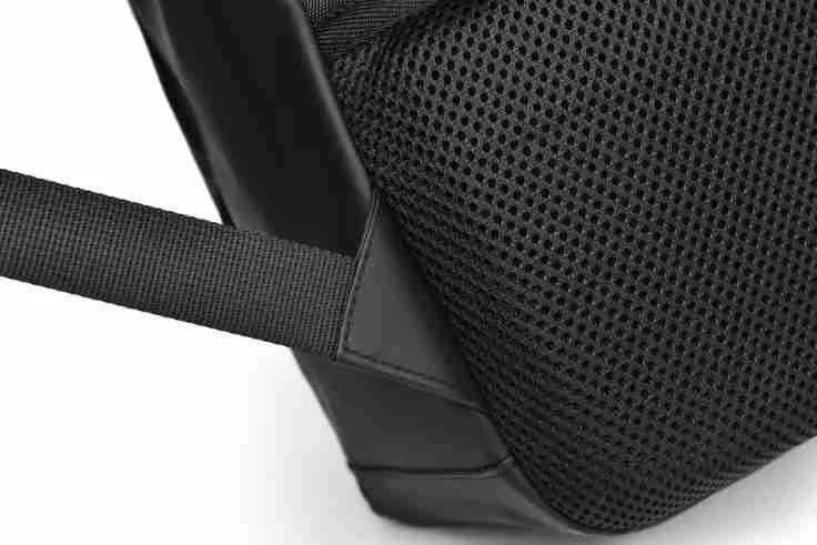 Large black waterproof PU leather laptop backpack with sewing thread details on a simple design.