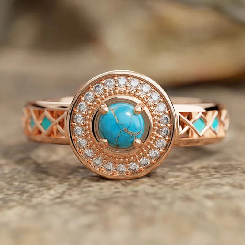 Rose gold copper women's ring with geometric design and inlaid turquoise zircon stones.
