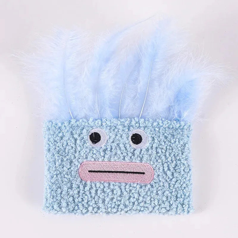 Colourful plush cat toy shaped like an explosion head with a large open mouth, shown in blue.