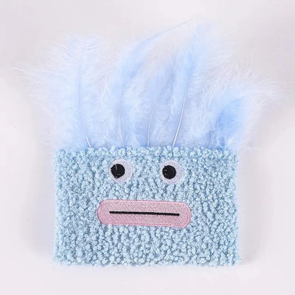 Colourful plush cat toy shaped like an explosion head with a large open mouth, shown in blue.