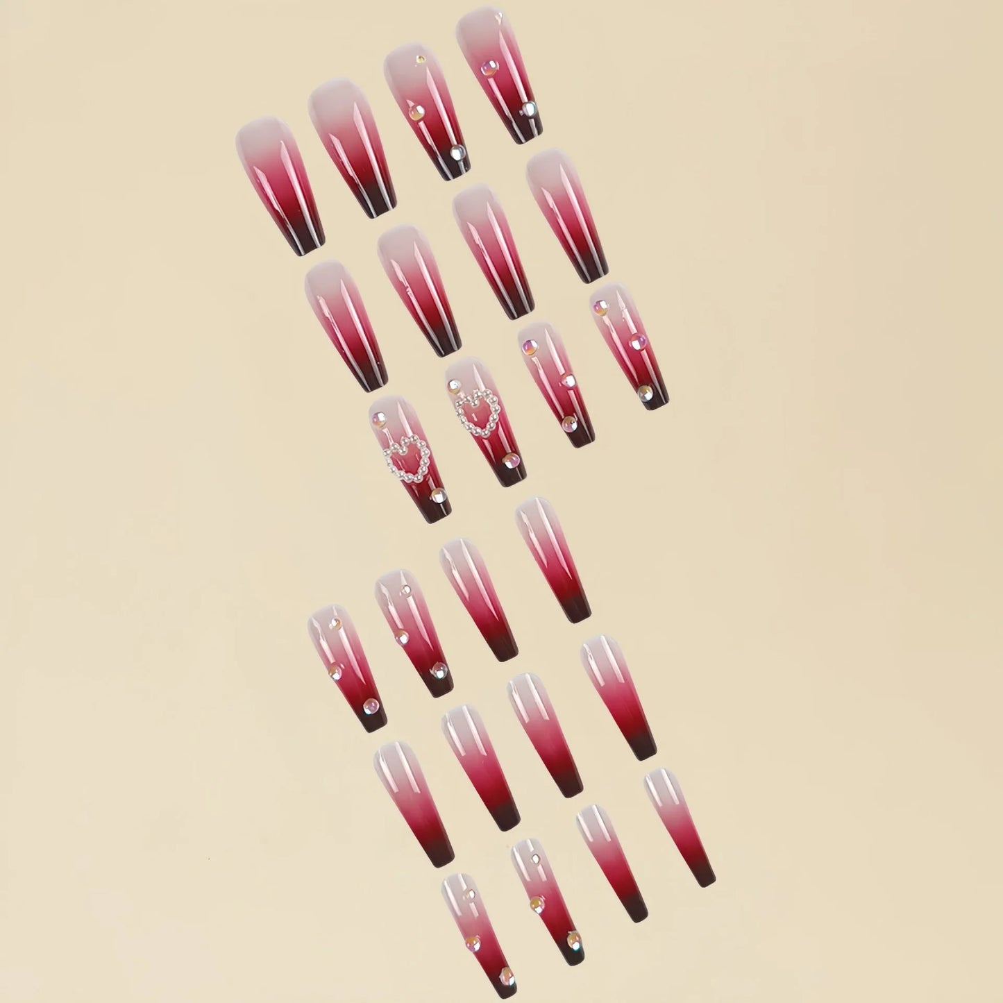Set of long false nail tips with wine red gradient colour, plaid pattern, and a pearl heart design.