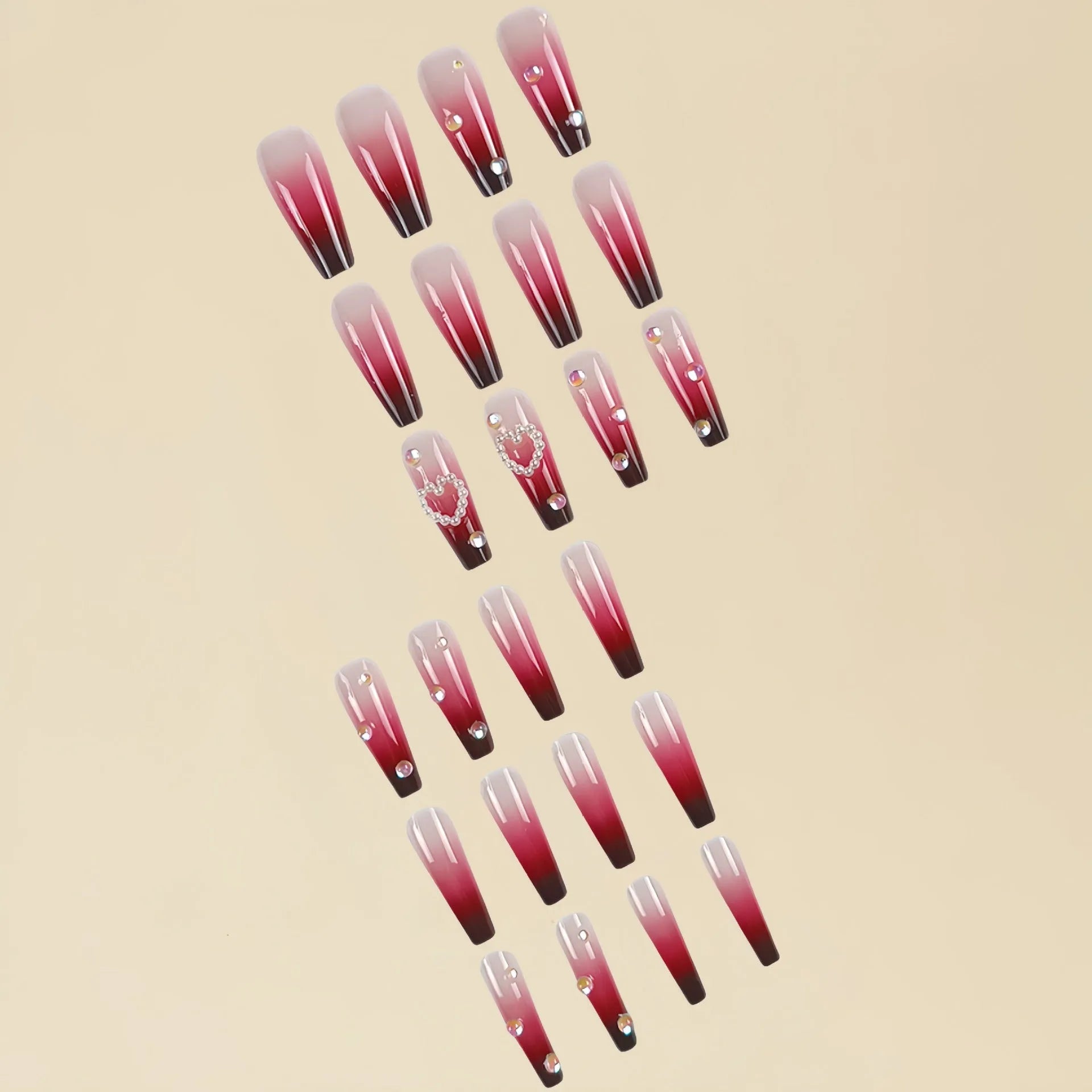 Set of long false nail tips with wine red gradient colour, plaid pattern, and a pearl heart design.