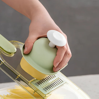 Shredded vegetable slicer with stainless steel blades on green cutting board