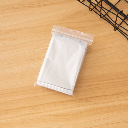 Portable double-sided silver emergency thermal blanket for outdoor adventures and survival situations