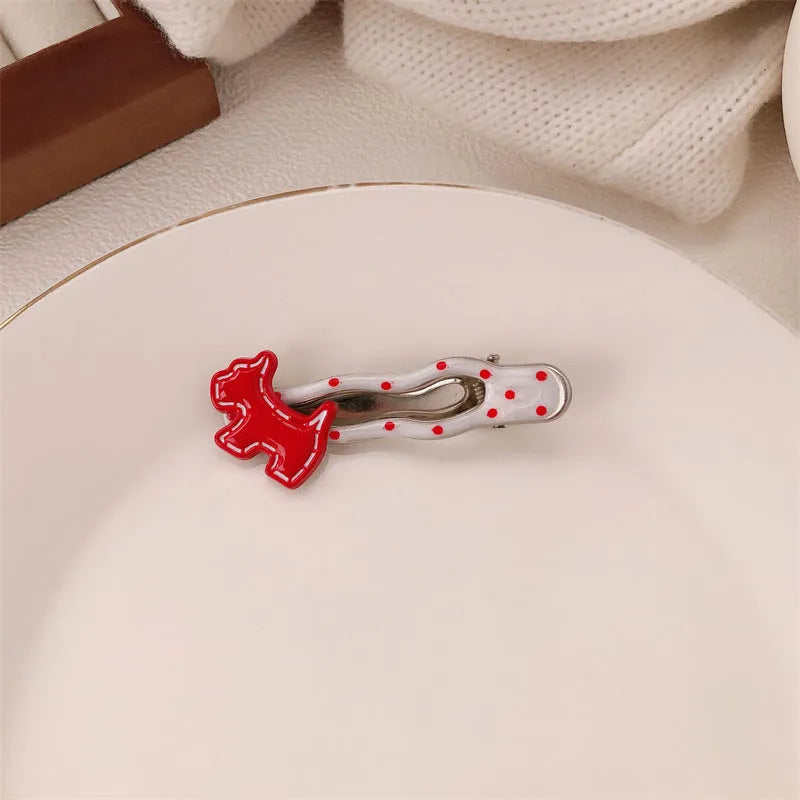 Red love heart-shaped hair barrette clip with retro white dots on a willow leaf-shaped base.