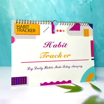 Habit tracking planner book open showing 12 internal pages, measuring 21cm by 28cm.