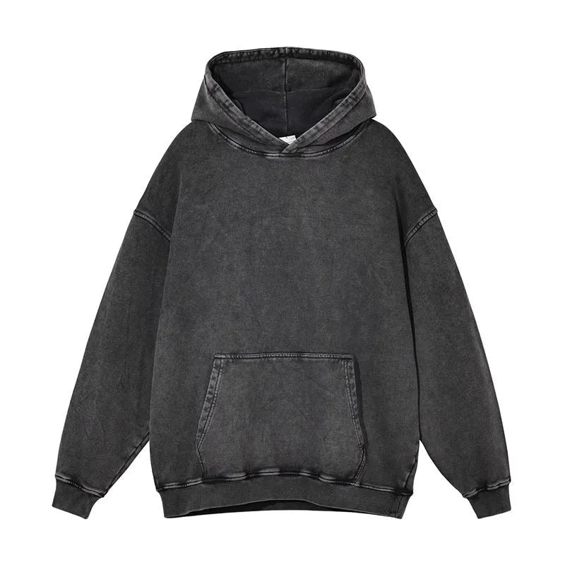 Man wearing a loose, collarless cotton hoodie with a batik-washed texture in a brown colour.