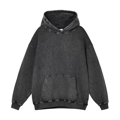 Man wearing a loose, collarless cotton hoodie with a batik-washed texture in a brown colour.