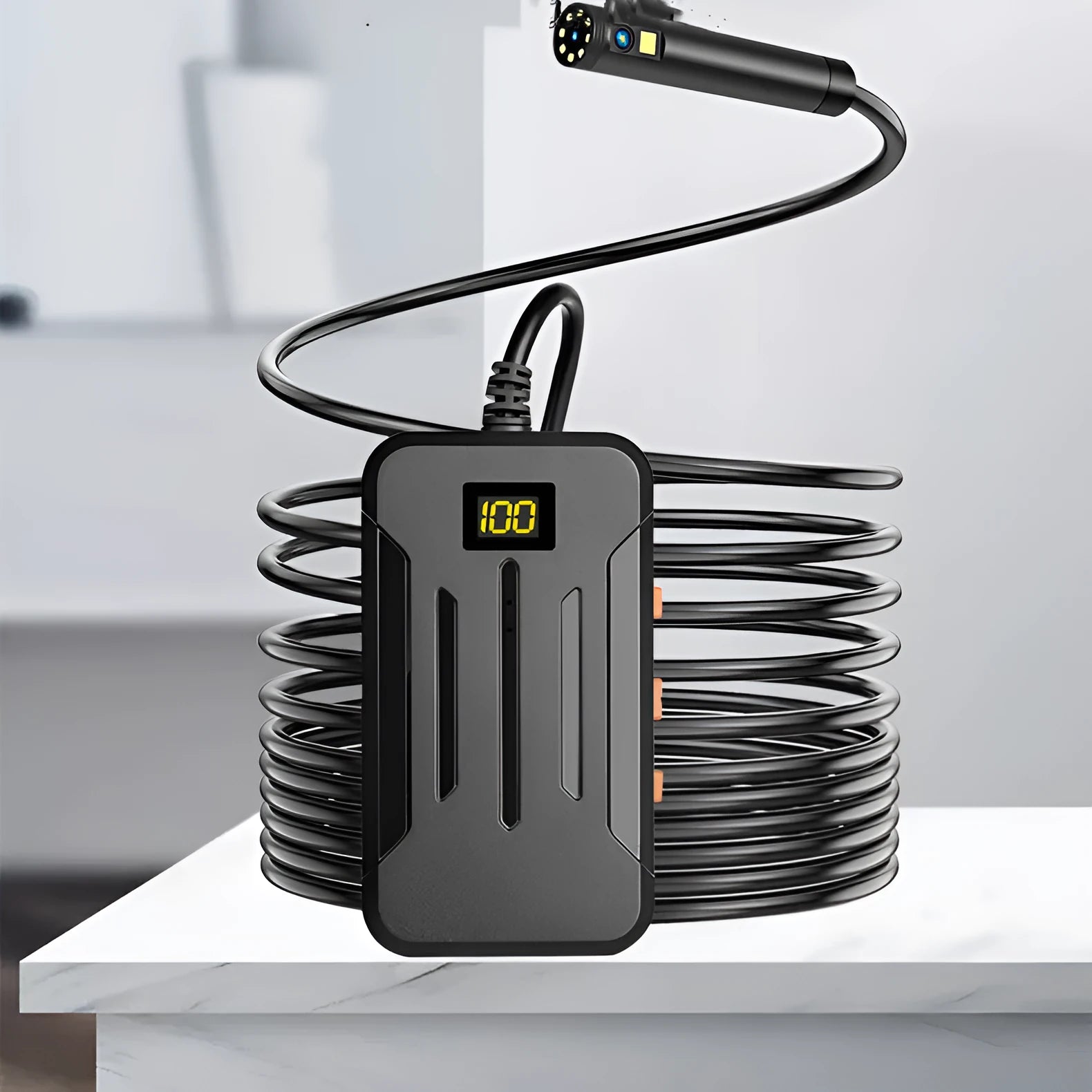 F300 wireless dual lens endoscope with IP68 waterproof probe, magnet, and hook accessories on a table.