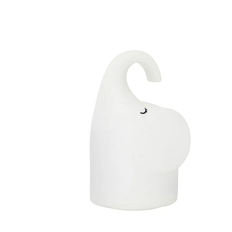 White elephant-shaped night light with silicone texture, 96mm wide by 151mm tall, emitting warm white glow