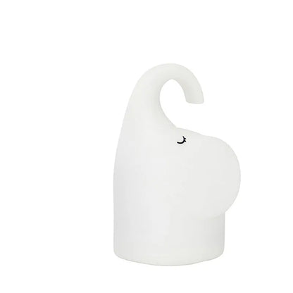 White elephant-shaped night light with silicone texture, 96mm wide by 151mm tall, emitting warm white glow