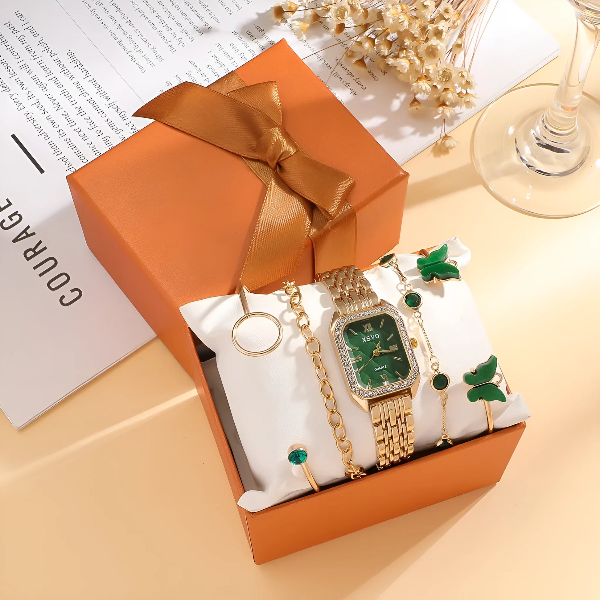 Gold green square women's watch with four matching butterfly bracelets on display