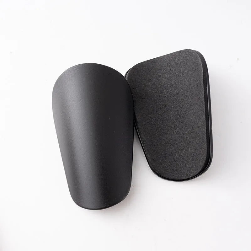 PU mini shin guards for football and running in black, white, red, and blue colours