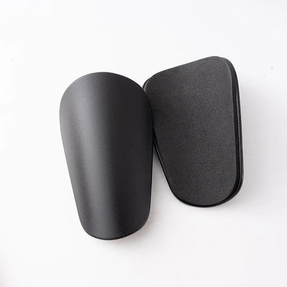 PU mini shin guards for football and running in black, white, red, and blue colours