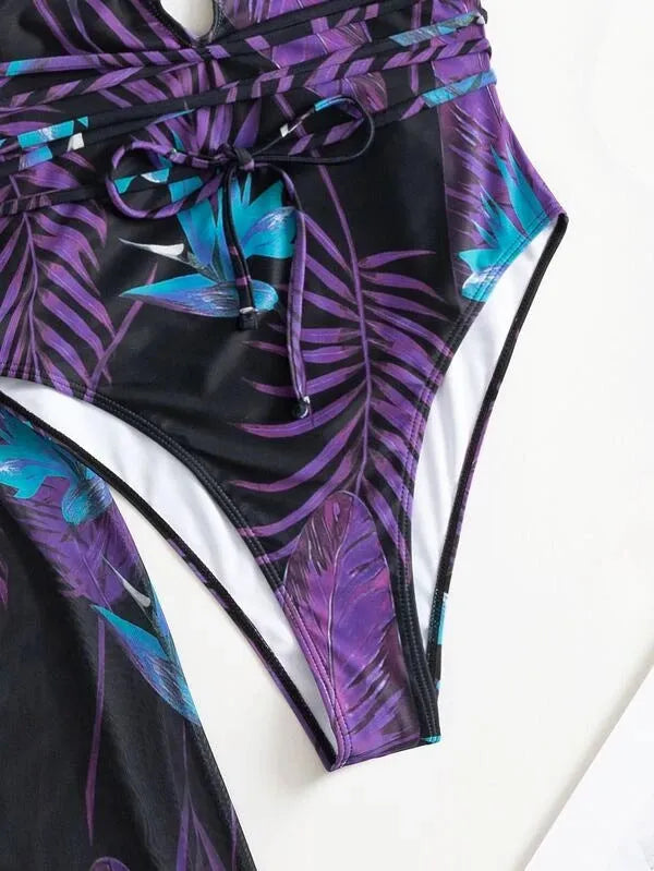Women's three-piece polyester swimsuit set with one-piece swimsuit and matching cover-up in a pattern design.