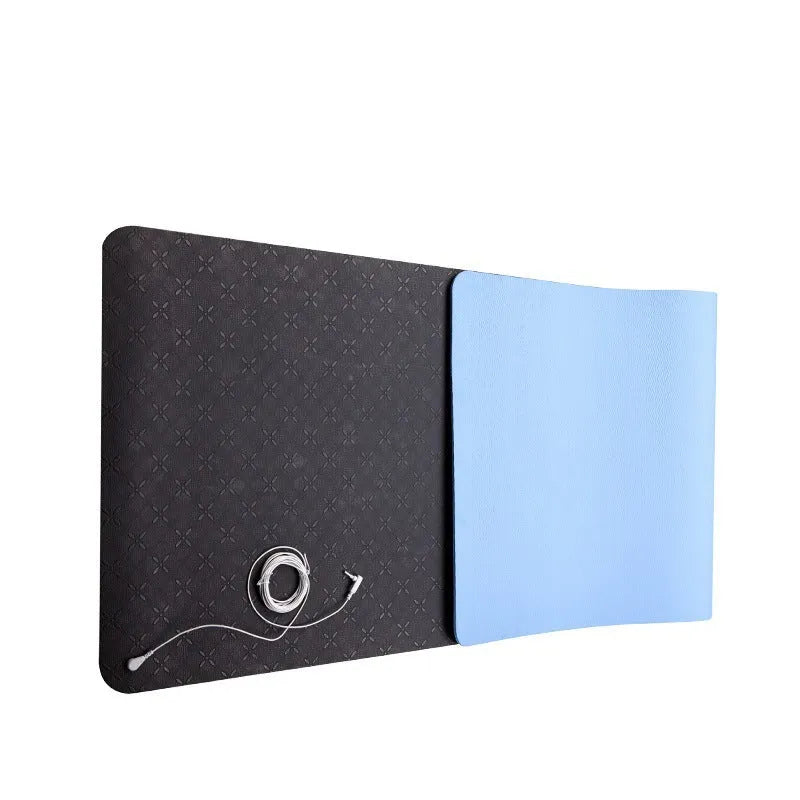 Blue conductive yoga mat with plant pattern, grounding wire, and non-slip surface, rolled partially.