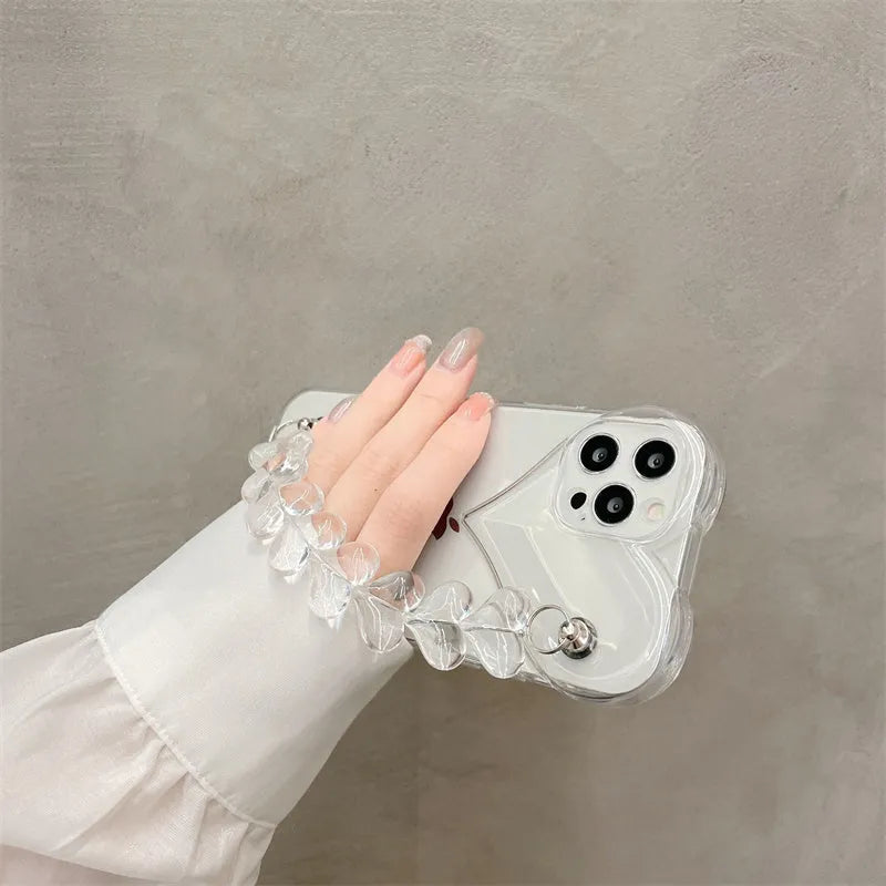 Transparent TPU iPhone case with love bracelet heart chain design on a mobile phone.