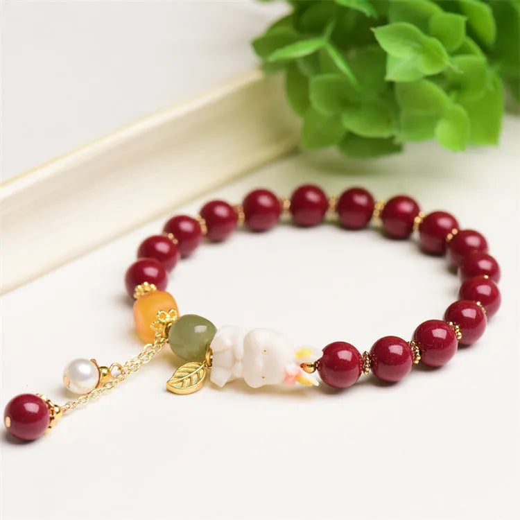 Traditional Chinese cinnabar bracelet with bunny design in purple-gold sand colour