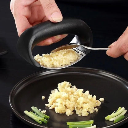 Stainless steel garlic press with non-slip handle for easy crushing