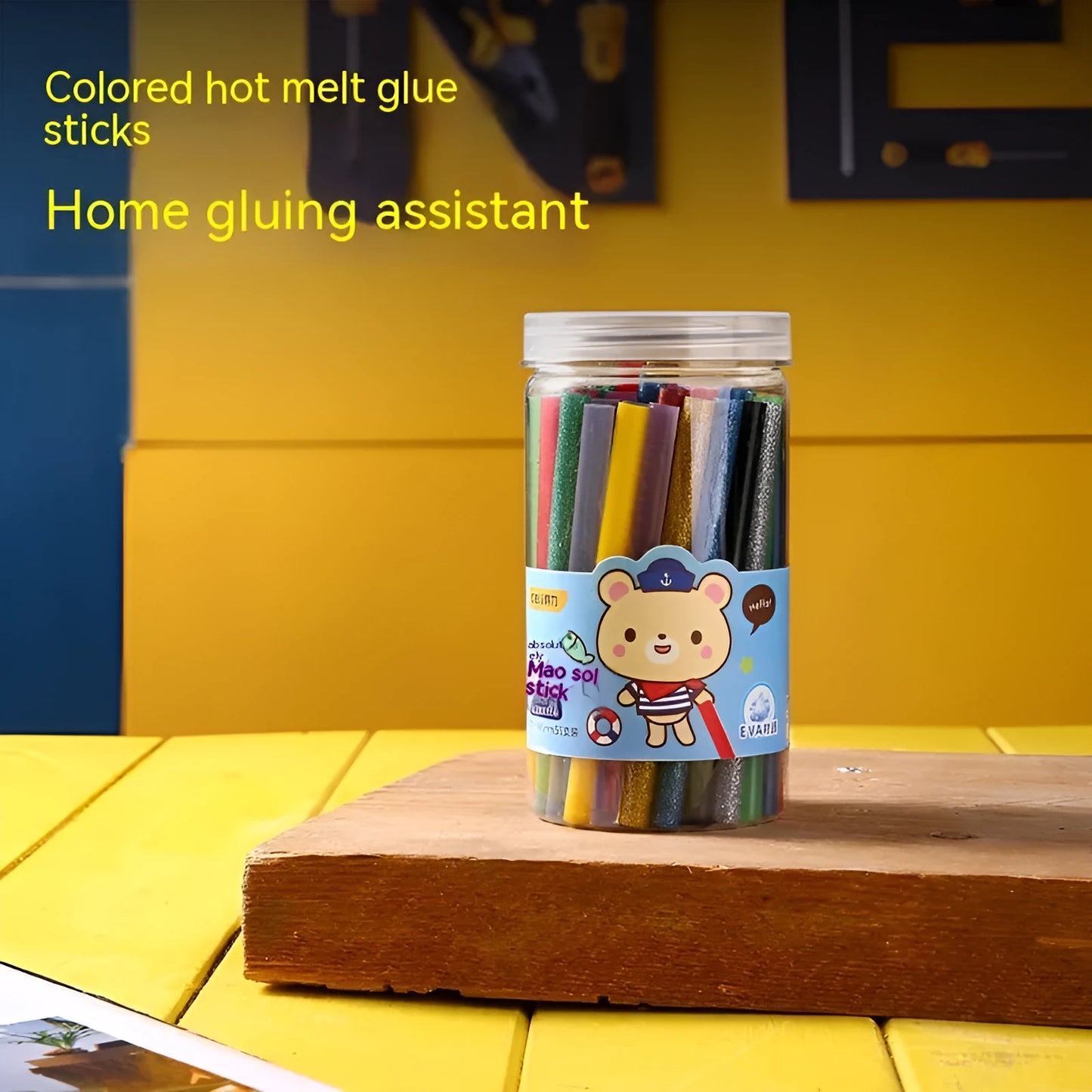 Pack of 55 clear hot melt glue sticks with 7.0mm diameter next to a glue gun
