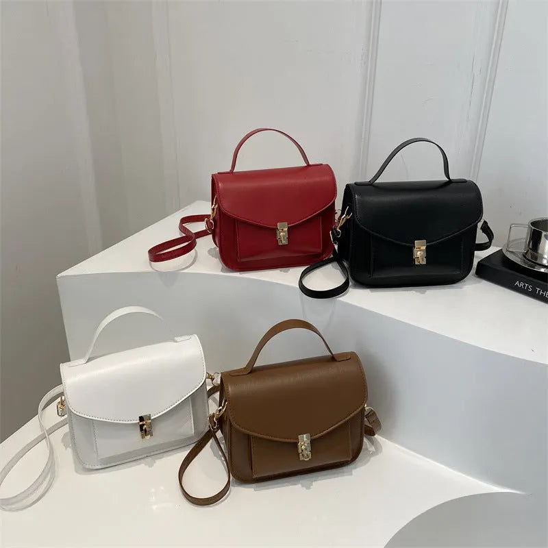 A horizontal square-shaped PU leather shoulder messenger bag in a choice of colours, showing the document compartment interior.