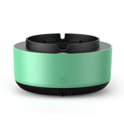 Grey intelligent electronic air purifier ashtray with fan, shown on a desk next to a cigarette.