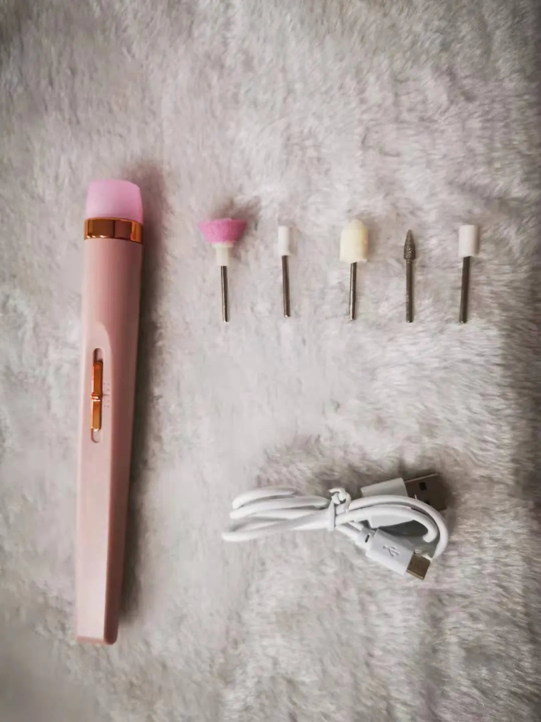 Cordless electric nail drill polisher set with USB charging cable and five grinding heads in white, red, pink colours
