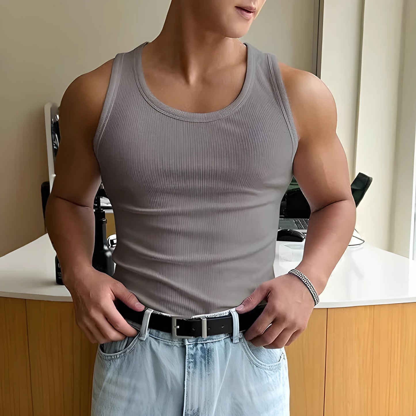 Men's tight-fitting grey sports t-shirt with a round neck, shown flat.