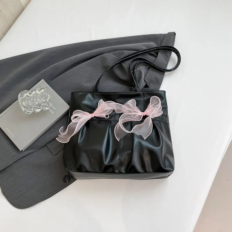 College style bow tote bag in black PU leather with double shoulder straps and bow detailing