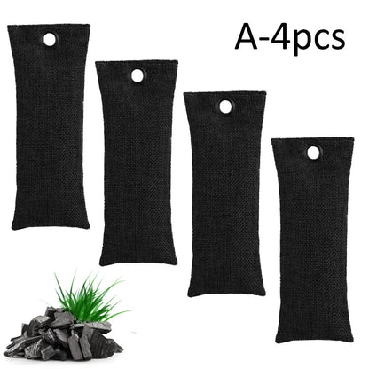 Set of black, green, grey, and blue rectangular bamboo charcoal deodorising bags on a white surface.