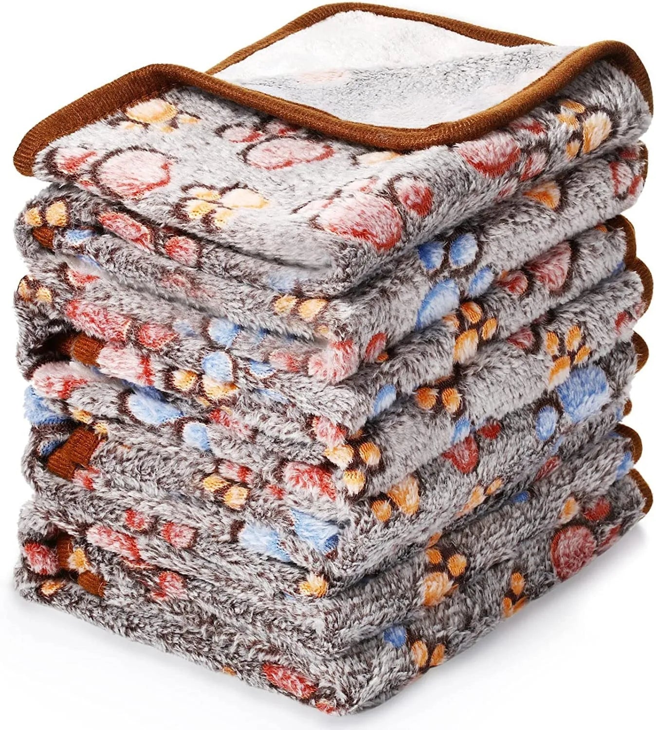 Coral fleece dog blanket with paw print pattern, shown in beige colour, laid flat to show size and soft texture.