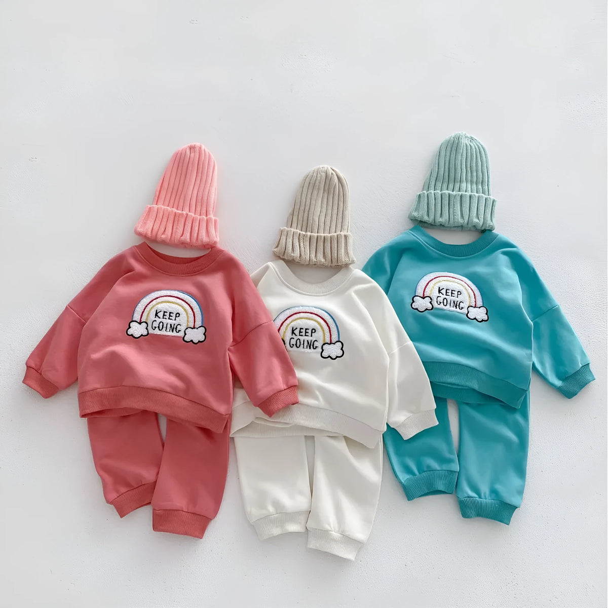 Children's cotton two-piece sweater set with pullover top and trousers in beige, emerald, or pink, sizes 66cm to 100cm.