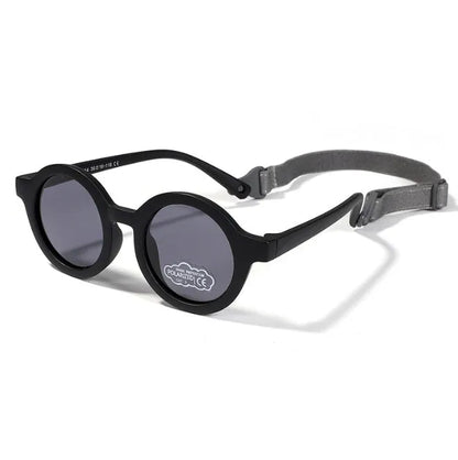 Children's round-frame polarised sunglasses with soft TPEE frame for ages 0-3, shown in assorted colours.