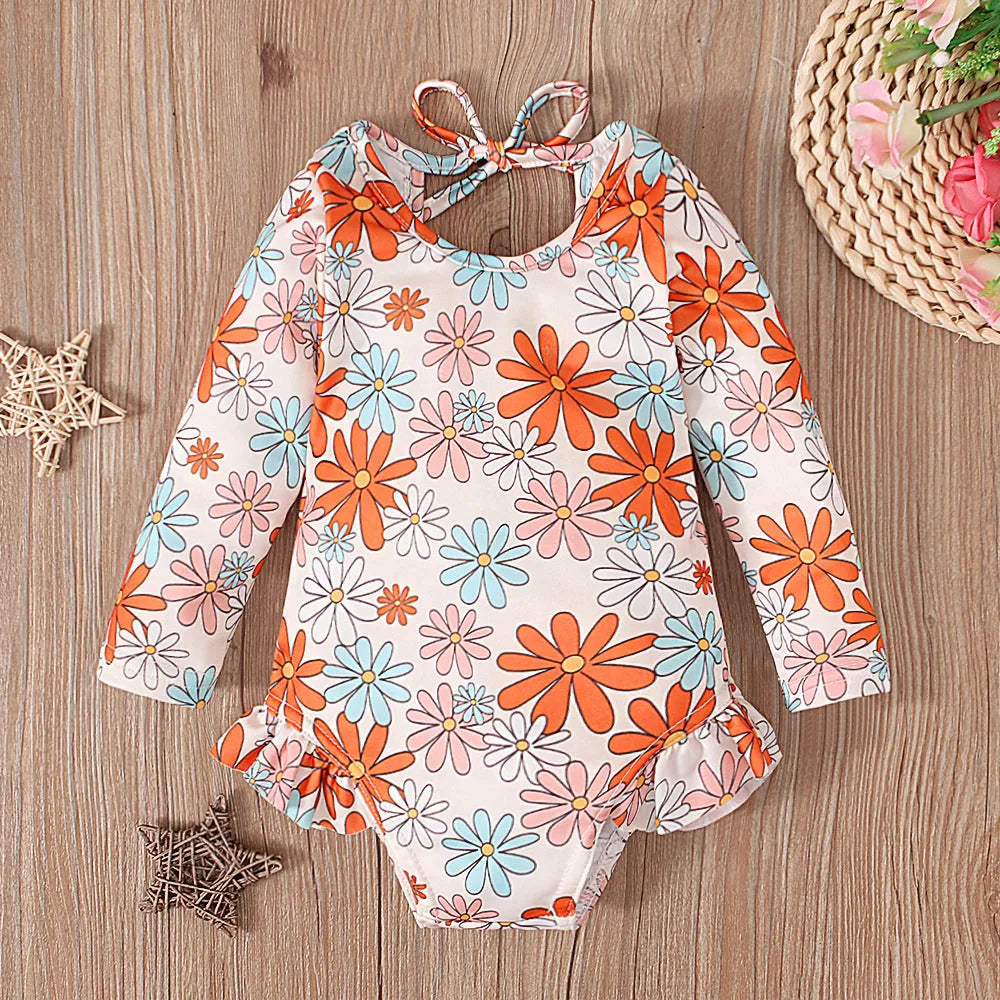 Girl's floral print swimsuit with open back crew neck design in polyester fabric
