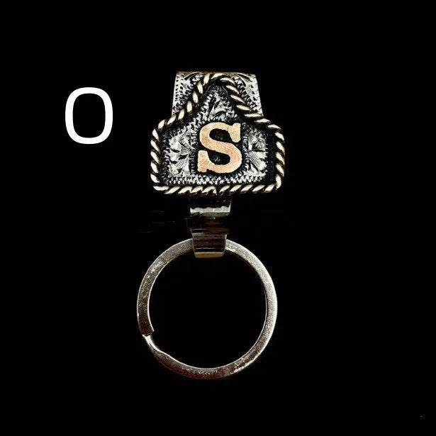 Handmade cow tag design metal keychain on a keyring, shown in one of many available colours.